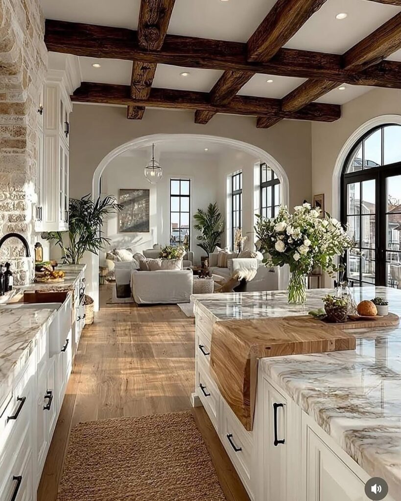 Dark brown rustic wooden exposed beams across a white ceiling in a farmhouse interior.